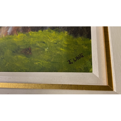 478 - A stunning framed oil 'Carrick-a-rede Rope Bridge' signed by Irish artist J White.