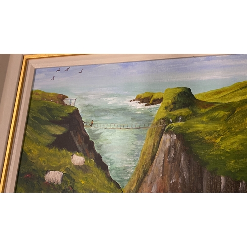 478 - A stunning framed oil 'Carrick-a-rede Rope Bridge' signed by Irish artist J White.