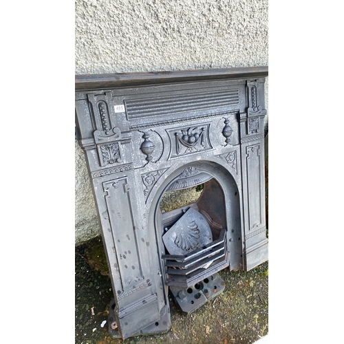 485 - An antique cast iron fireplace.