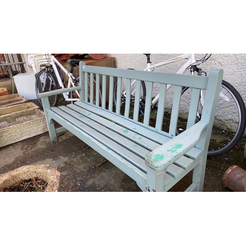 495 - A wooden garden bench.