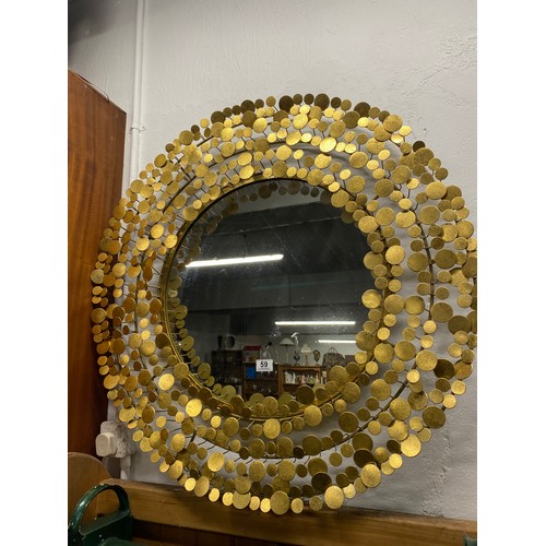 59 - A stunning large Mid Century style gilt metal wall mirror measuring 90cm in diameter.