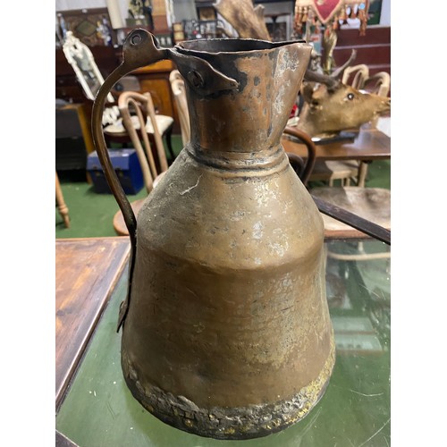 70 - Two antique pans and a metal pitcher.