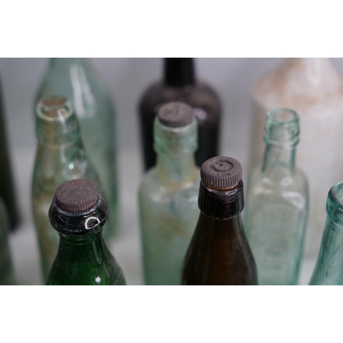 1 - A large lot of vintage & antique glass bottles to include F Underwood, Carlisle, E Johnson & Sons Op... 