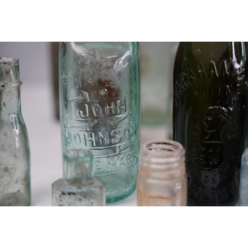 1 - A large lot of vintage & antique glass bottles to include F Underwood, Carlisle, E Johnson & Sons Op... 