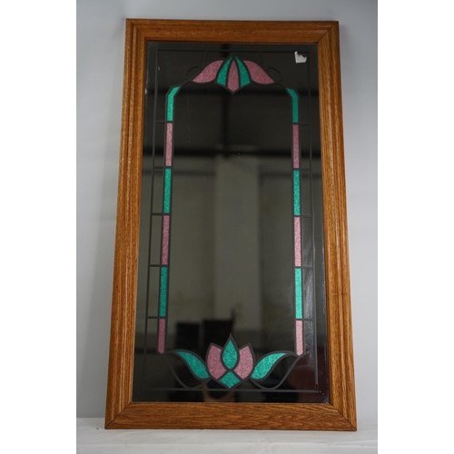 101 - A decorative wall mirror with lead design.