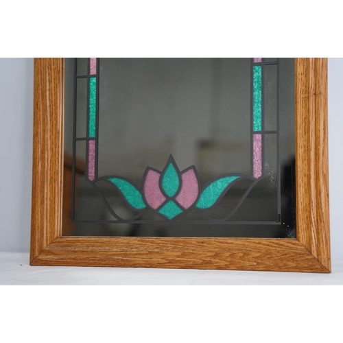 101 - A decorative wall mirror with lead design.