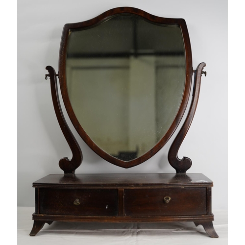 103 - A mahogany shield shaped dressing table mirror.