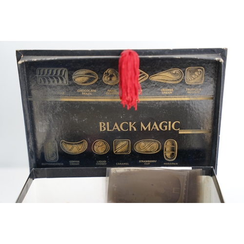 109 - A vintage Black Magic sweet box, photographs, diaries and more.