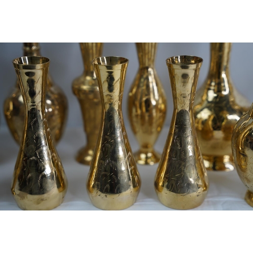 13 - A collection of vintage brass vases.