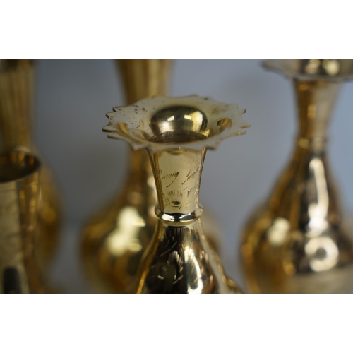 13 - A collection of vintage brass vases.