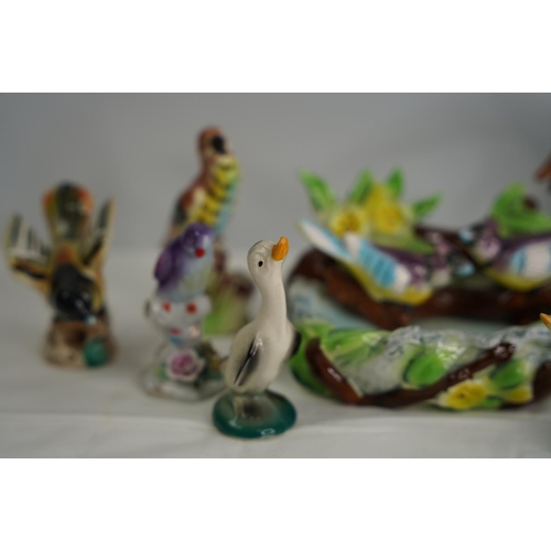 15 - A collection of bird figures.