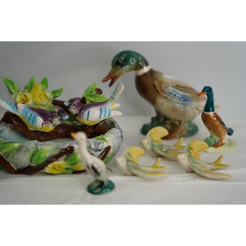 15 - A collection of bird figures.