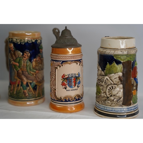 16 - Four German pottery style tankards.