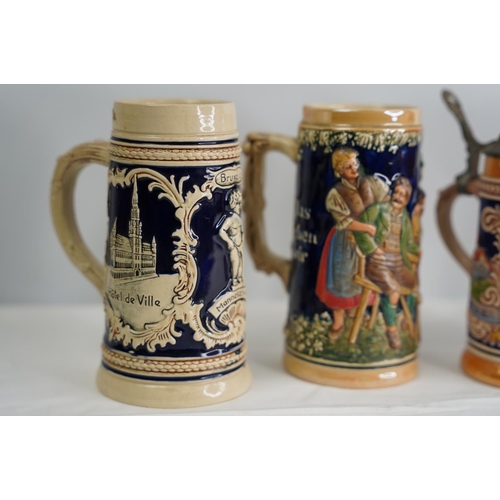 16 - Four German pottery style tankards.