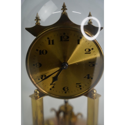 24 - A stunning West German anniversary clock on a marble base and glass dome.