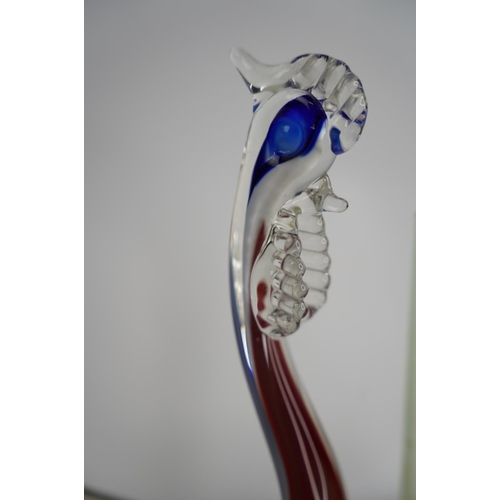 37 - A vintage glass bird figure.