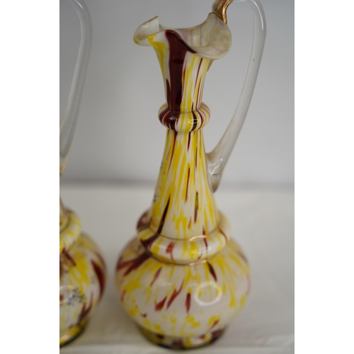 43 - A pair of vintage Murano glass jugs.