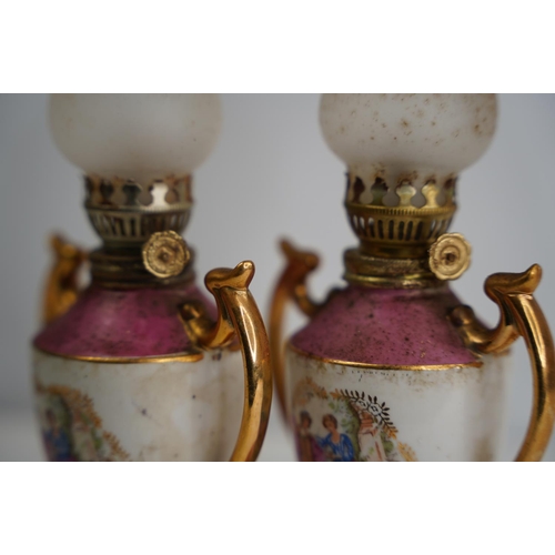 46 - A pair of Limoge style miniature oil lamps.