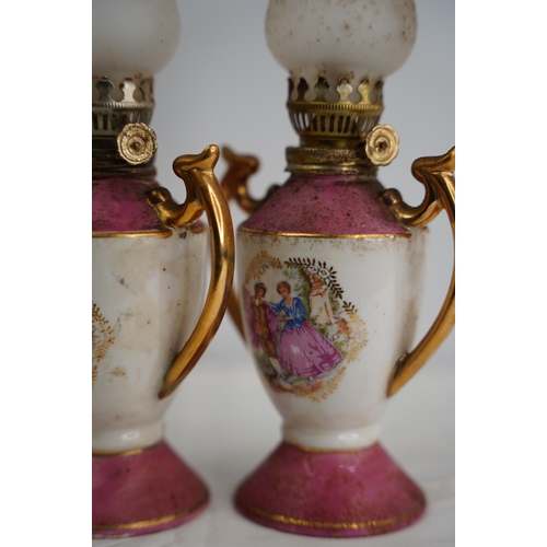 46 - A pair of Limoge style miniature oil lamps.