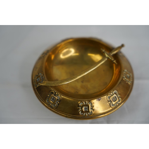 51 - A decorative antique brass ashtray with sword.