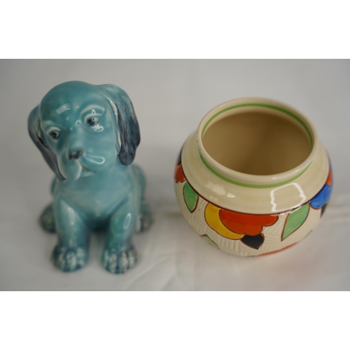 52 - A vintage Beswick dog and a Royal Doulton art deco patterned pot.