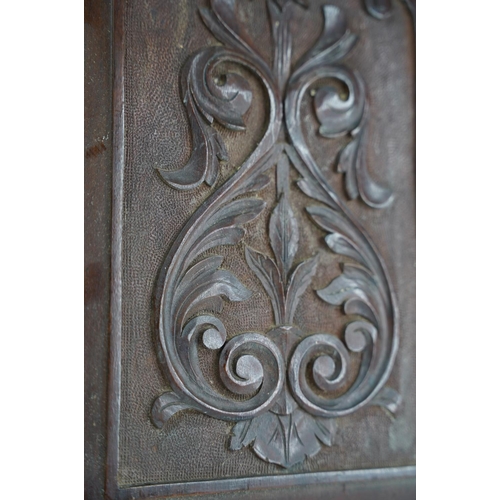 54 - A pair of antique carved wooden panels.