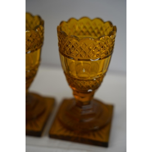 56 - A pair of vintage amber glass vases.