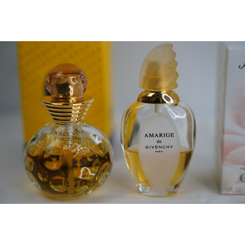 63 - Three bottles of vintage perfume - Amarige de Givenchy, Christian Dior Dolce Vita and Anais Anais.