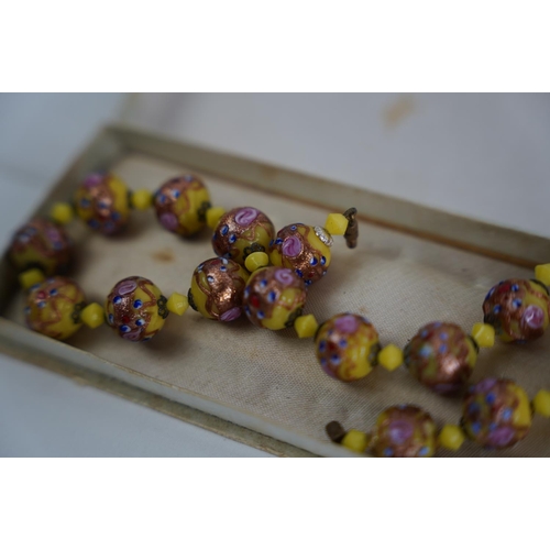 73 - A stunning pair of vintage hand painted beads.