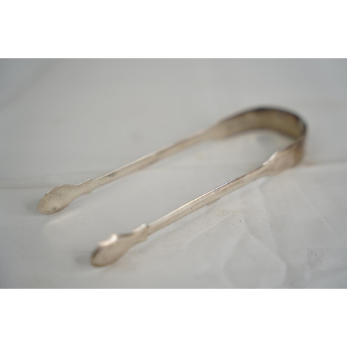 76 - A pair of Georgian Sterling Silver tongs, London 1809.