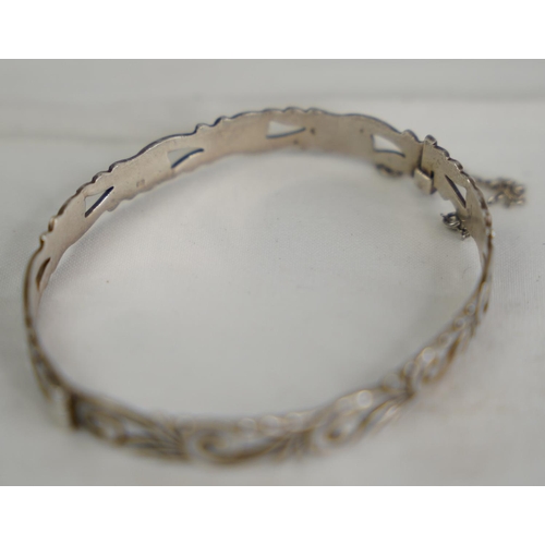 78 - A Sterling silver bangle.