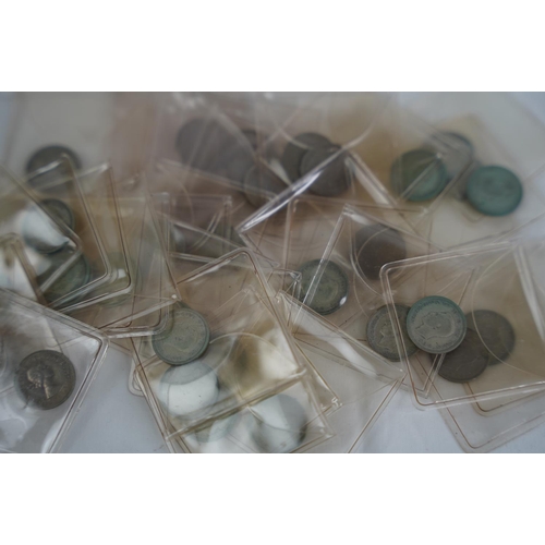 86 - A lot of Six pence coins in presentation wallets.