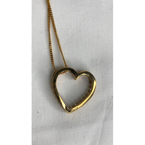 147 - A 9ct gold diamond heart shaped pendant and 16