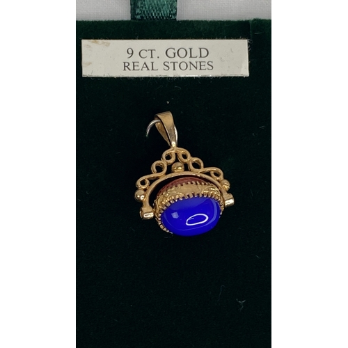 148 - A 9ct gold lapis & agate revolving fob.