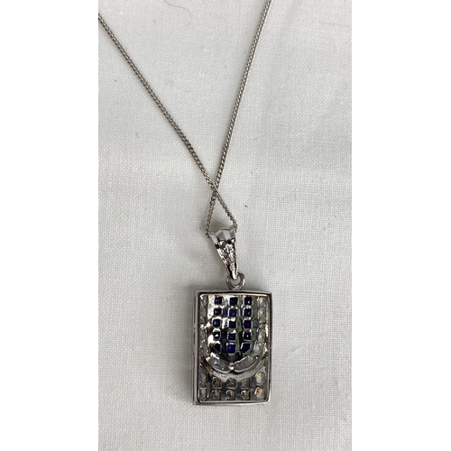 150 - A 9ct white gold pendant and chain.