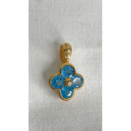 153 - A 9ct gold blue topaz pendant.