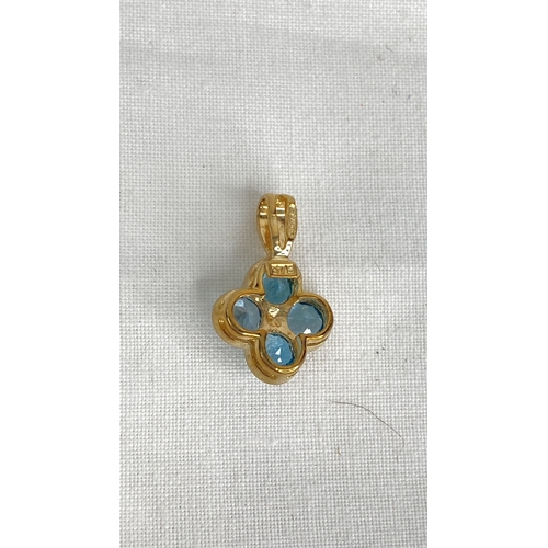 153 - A 9ct gold blue topaz pendant.