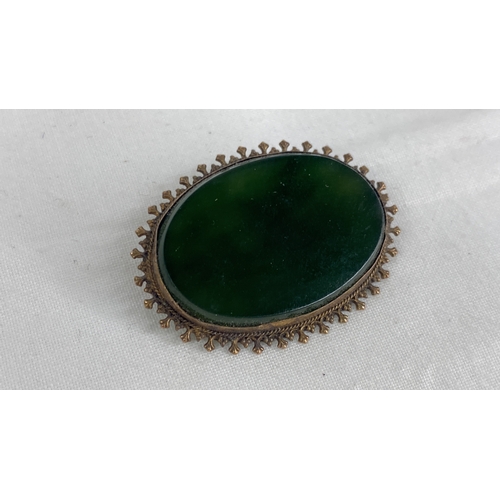 159 - A Sterling silver black onyx brooch.