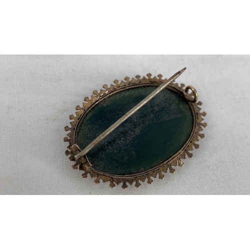 159 - A Sterling silver black onyx brooch.