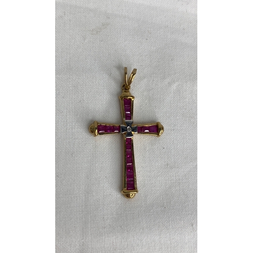 160 - A 9ct gold ruby and diamond cross pendant.