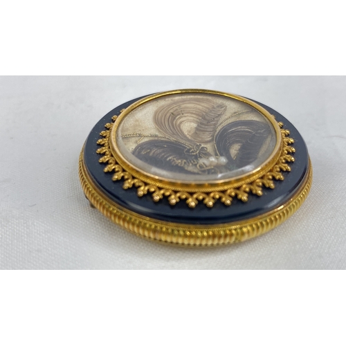 165 - An antique mourning brooch.