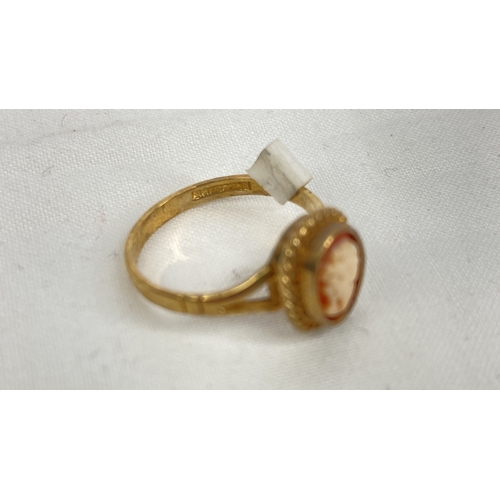 167 - A 9ct gold and cameo ring, size K.