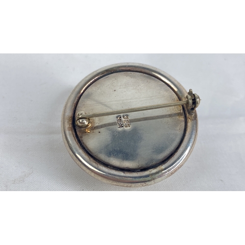 170 - A Sterling silver brooch. 24.11g.