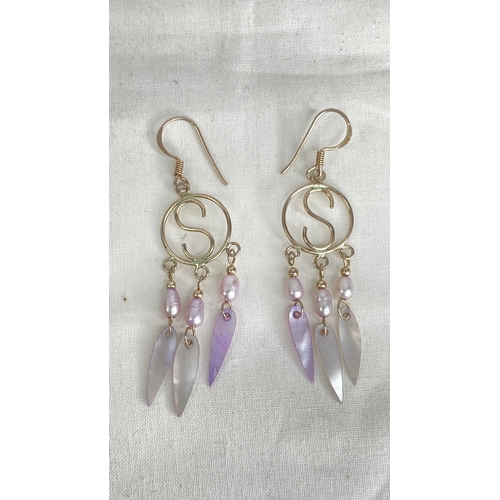 181 - A pair of Sterling silver and shell earrings.