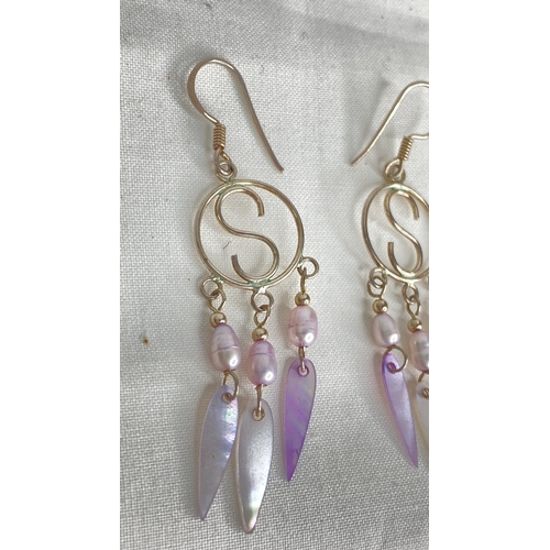 181 - A pair of Sterling silver and shell earrings.