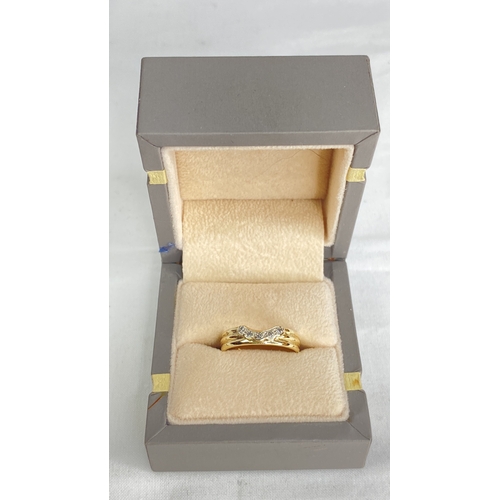 187 - A 9ct gold and diamond ring.