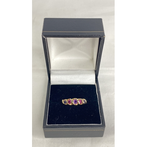 190 - A 9ct gold ring set with sapphire, ruby and amethyst.