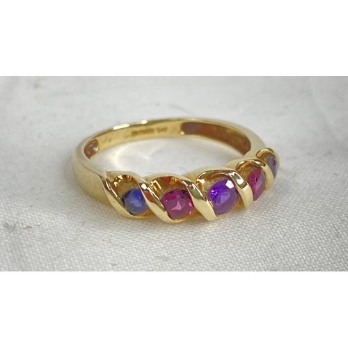 190 - A 9ct gold ring set with sapphire, ruby and amethyst.