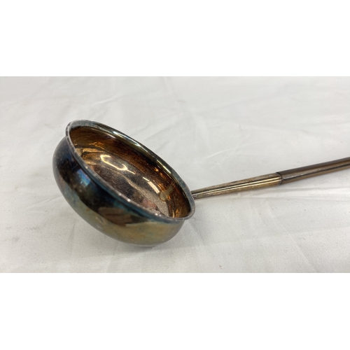 193 - A large Georgian Sterling silver punch ladle with whalebone handle circa 1800.