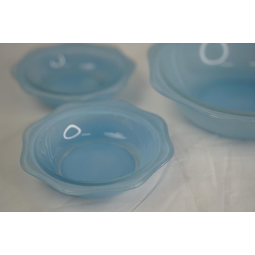 113 - A set of vintage Pyrex blue glass bowls.